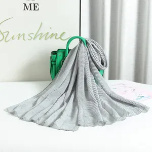 Grey pleated scarf with silver wire crinkle design, elegant long sun protection wrap.