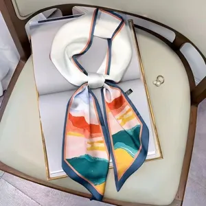 Elegant long silk twilly scarf with colorful abstract landscape print, versatile hair or neck accessory.