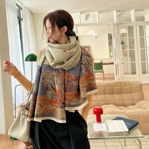 Detailed view of the autumn winter cashmere feel printed warm shawl scarf worn by model.