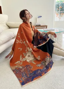 Detailed view of a thick warm winter scarf with exquisite traditional landscape and floral print.