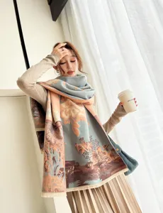 Detail view of the warm cashmere-feel winter scarf with vintage artistic print and tassels.