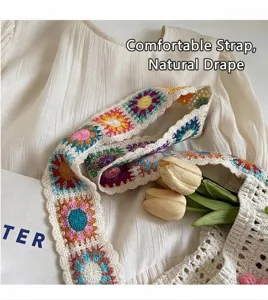 Macro view of colorful crochet sunflower patterns on a bohemian style knitted shoulder bag