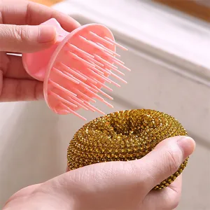 Kitchen cleaning brush with detachable brush head and golden scouring ball for washing dishes.