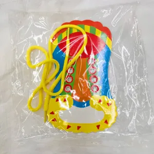 Kids shoelace tying practice educational toy detail view showing board and yellow lace.