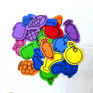 Close-up of colorful foam fruit and vegetable stickers set showing various shapes and bright colors.