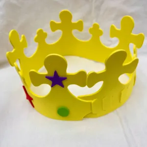 Detailed view of the yellow EVA foam crown DIY birthday hat featuring star and dot decorations.
