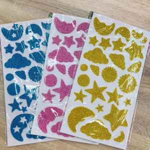 Glitter foam stickers detail showing vibrant star, moon and cloud shapes for kids crafts.