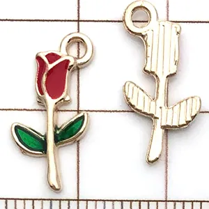 Close-up detail view of red enamel rose flower metal charm pendant for DIY jewelry making.
