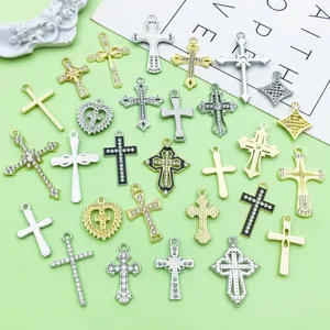 Mixed alloy cross pendants closeup, rhinestone and hollow design jewelry DIY accessories.