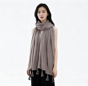 Long tassel hijab scarf with silver trim, versatile fashion shawl for women daily wear.