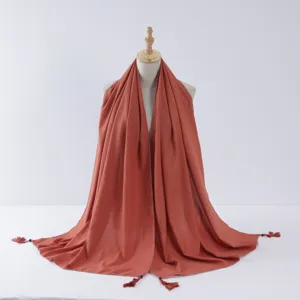 Rust red long scarf with tassels and silver trim, elegant fashion hijab and versatile shawl.