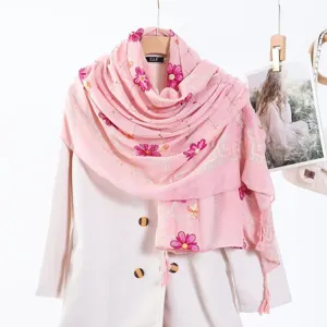 Pink embroidered scarf detail showing floral pattern, hot drill rhinestones and delicate tassel fringe.