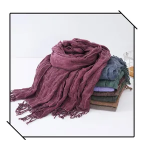 Detailed view of soft cotton linen wrinkled scarf with fringe, featuring cozy multi-color layers.