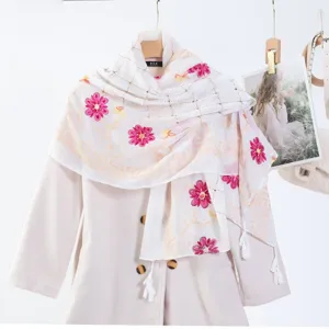 White embroidered scarf with pink floral pattern tassel wrap shawl delicate detail view