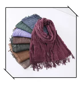 Detailed view of multi-color crinkled linen scarves set with chic fringe edges for daily wear.
