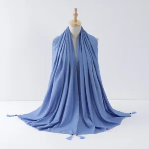 Close-up detail of blue beaded tassel scarf with silver wire rolled edge for everyday wear.