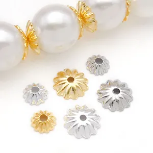 Metal flower bead caps detail view, gold and silver color, perfect for DIY jewelry making.