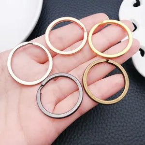 Close-up detail of multi-color alloy round split key rings for DIY handmade jewelry charms.