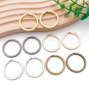 Detailed view of mixed multi-color alloy round keychain rings for DIY jewelry making accessories.