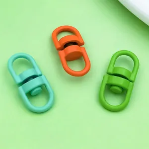 Closeup of colorful alloy swivel clasps, ideal for DIY jewelry making and keychain pendants.