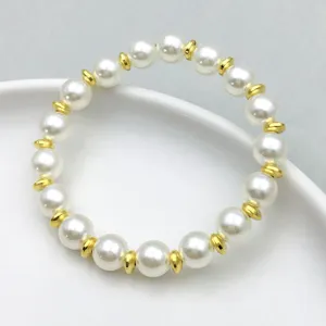 Elegant pearl bracelet with gold spacer beads, stylish jewelry accessory for daily wear.