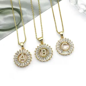 Gold plated round letter pendant necklace with sparkling cubic zirconia stones, elegant jewelry.