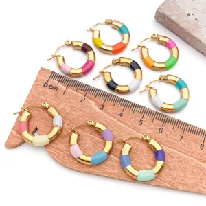 Colorful enamel stainless steel huggie hoop earrings, stylish waterproof metal jewelry detail.