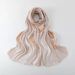 Close-up view of the elegant embroidered long scarf featuring delicate sequins and smooth fabric texture.