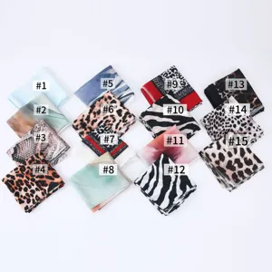 Women fashion satin polyester printed scarf collection with diverse animal and abstract patterns.