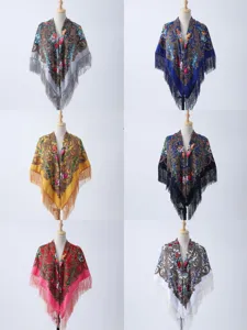 Detailed view of ethnic paisley floral print women shawl with elegant fringe edges.