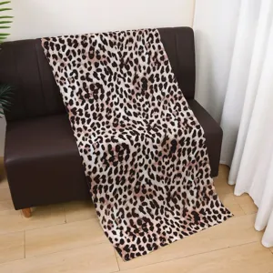 Detail view of the elegant leopard print satin polyester long scarf and versatile women shawl.