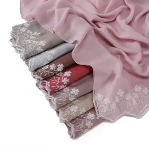 Detailed view of women's chiffon long scarf featuring delicate two-end floral embroidery.