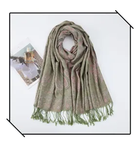 Detailed view of the elegant green paisley embroidered fringe tassel scarf showcasing fine texture.