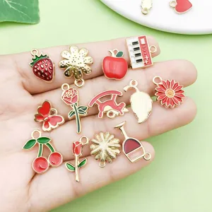 Detailed close-up of mixed red enamel alloy charms, perfect for DIY jewelry making accessories.