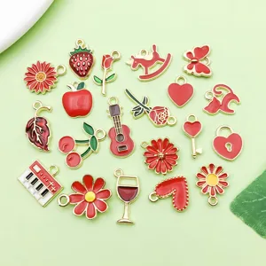 Close-up detail of mixed red enamel alloy charms, perfect for DIY jewelry making and bracelets.