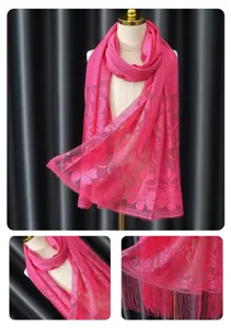 Hot pink lace scarf hijab with floral hollow pattern and tassel edge for women fashion detail view.