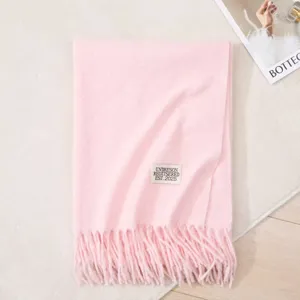 Pink long faux cashmere winter scarf with fringe design, soft, warm and elegant casual accessory.