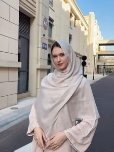 Detailed view of the minimalist solid color slub long scarf, soft breathable outdoor wear.