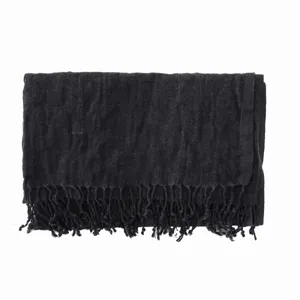 Black cotton linen fringed wrinkled scarf detail shot showing fabric texture and tassel trim