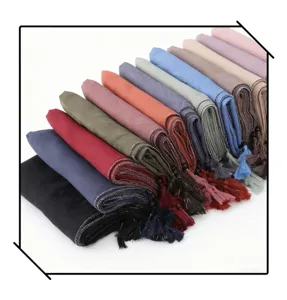 Detailed view of multi-color long scarves featuring silver wire edges, beads and chic tassels.