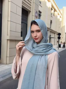 Detailed view of the solid light blue slub long scarf, minimalist design for versatile outfits.