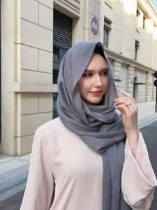 Elegant solid color textured long scarf for women, breathable and stylish daily hijab wrap.