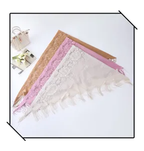 Elegant lace triangle scarf with hollow design and tassels, chic solid color stylish shawl.