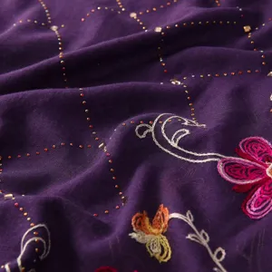 Close-up detail of purple cotton linen rhinestone embroidered floral scarf shawl.
