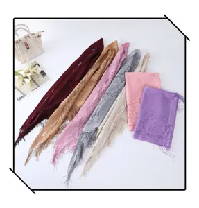 Detailed view of lace fringe triangular scarf, multi-color hollow shawl for women daily wear.