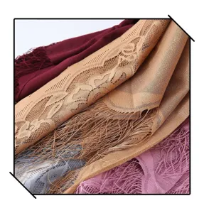 Close-up detail of women's hollow lace fringe scarf shawl, showing delicate mesh texture and solid color.