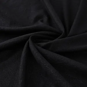 Black shimmering fabric detail shot, elegant glitter texture close-up display view.