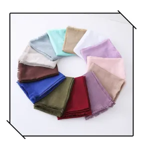 Detailed view showing multi-color solid slub scarves arranged neatly in a vibrant color wheel.
