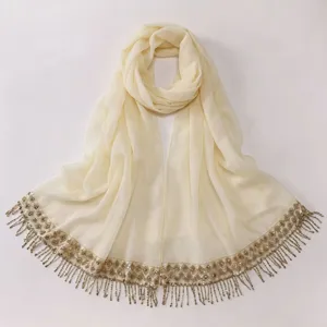 Beige chiffon hijab scarf with elegant sequin tassel fringe, lightweight long headscarf.