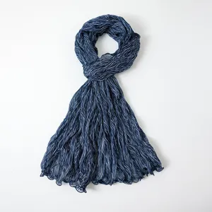 Detailed view of crinkled striped metallic gauze scarf showing fine texture and shimmer.